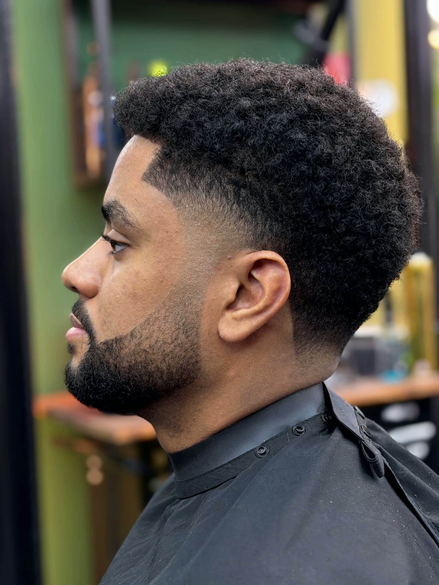Curly hair fade with sharp line-up